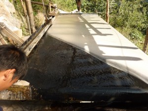Daniel showing a tungsten sluice Daniel showin a tungsten sluice